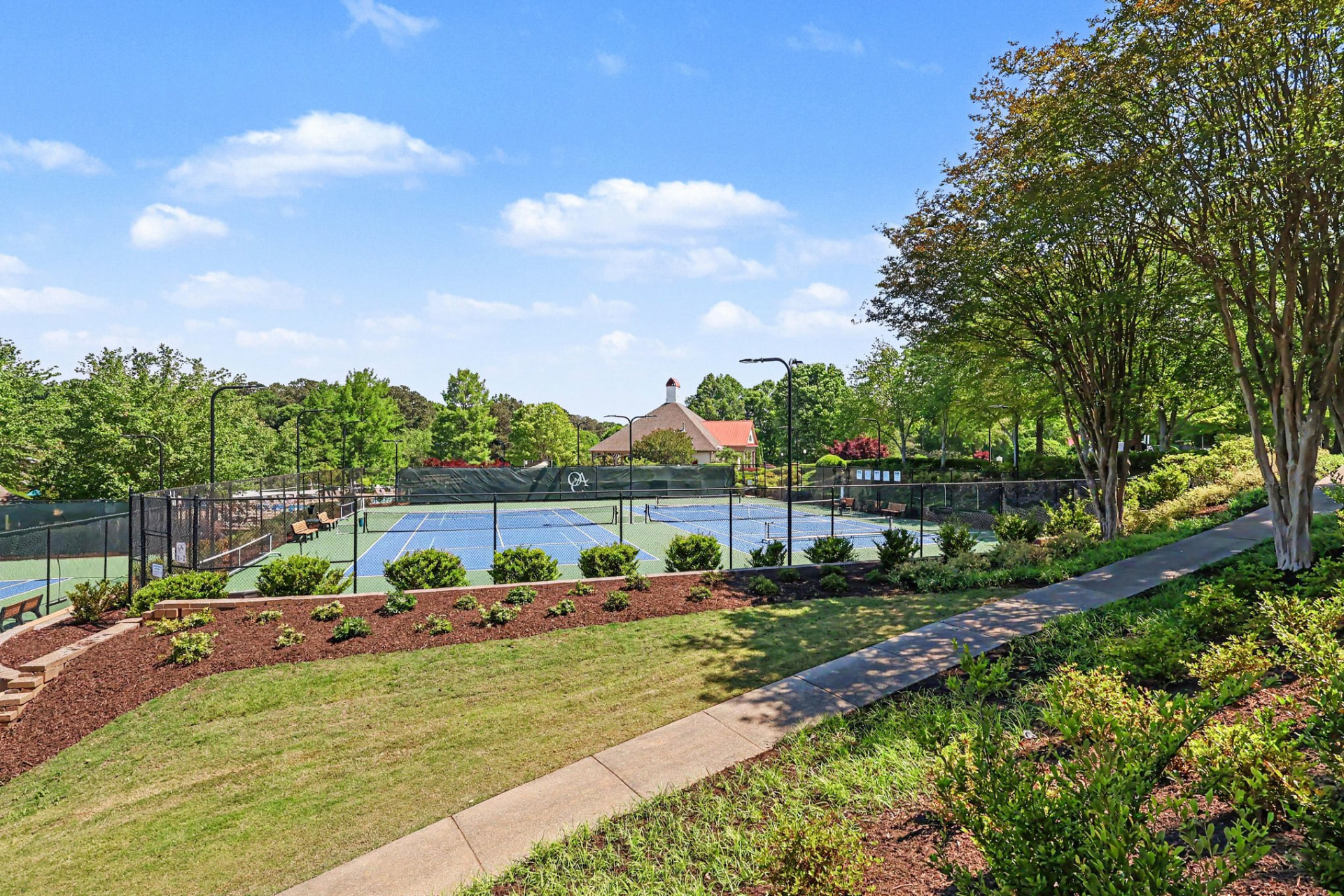 Landscaped walkway overlooking the tennis courts at Olde Atlanta Club