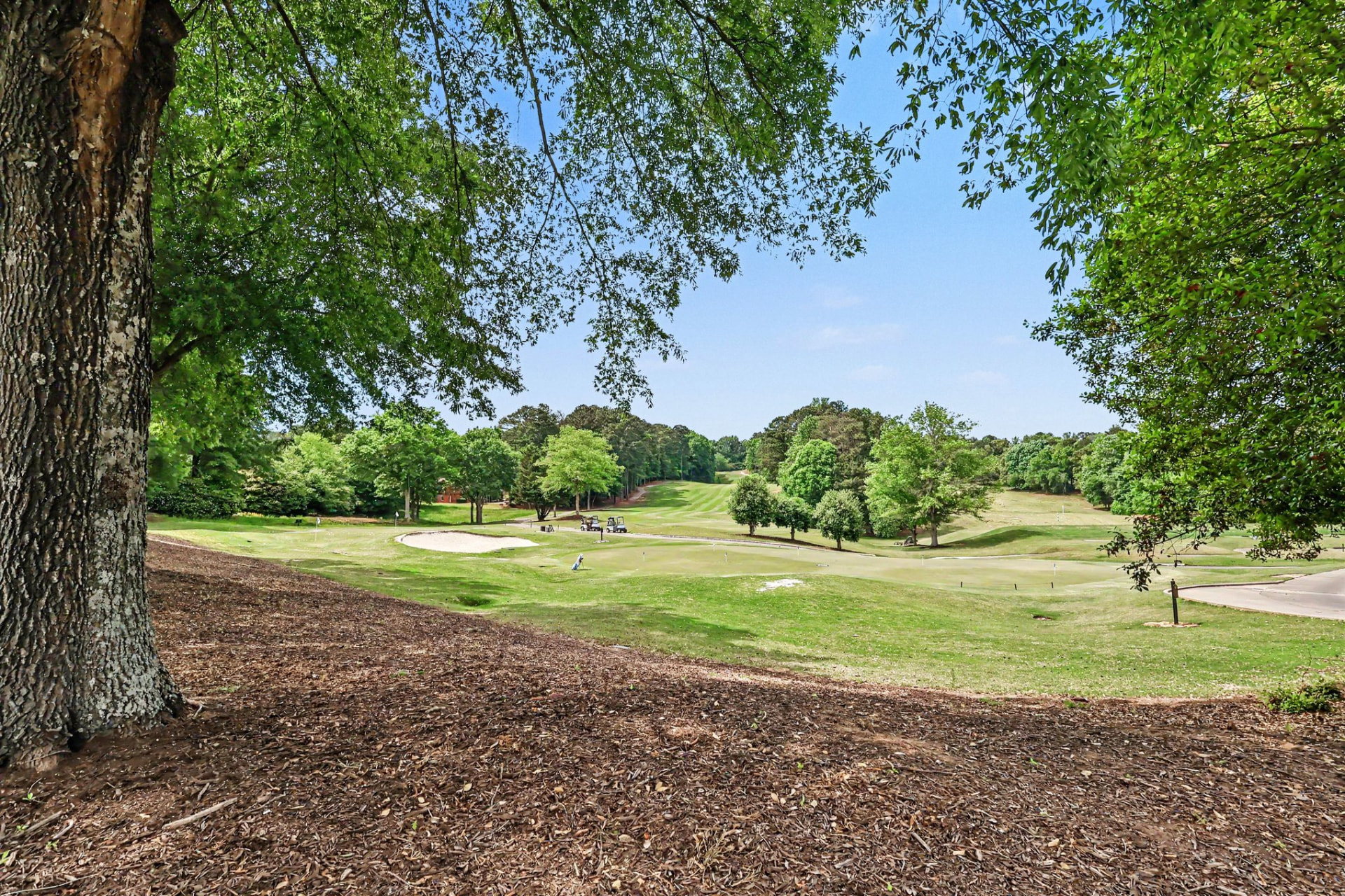 Manicured green and bunker on the Olde Atlanta golf course