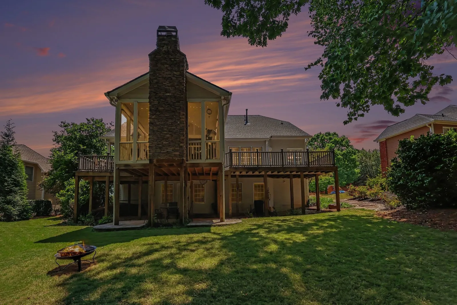 Rear exterior of the home at dusk