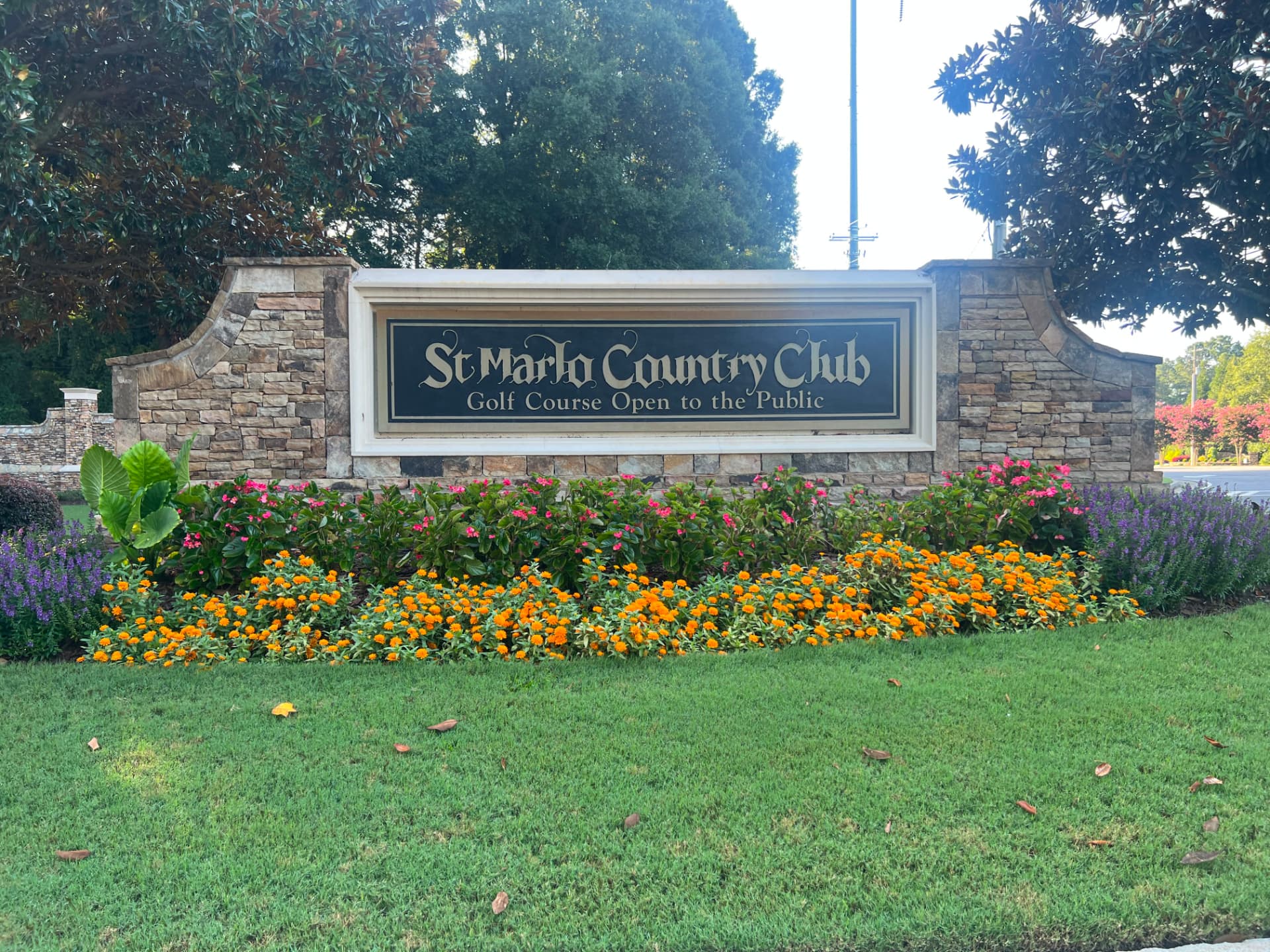 Landscaped St. Marlo Country Club and golf course entrance monument