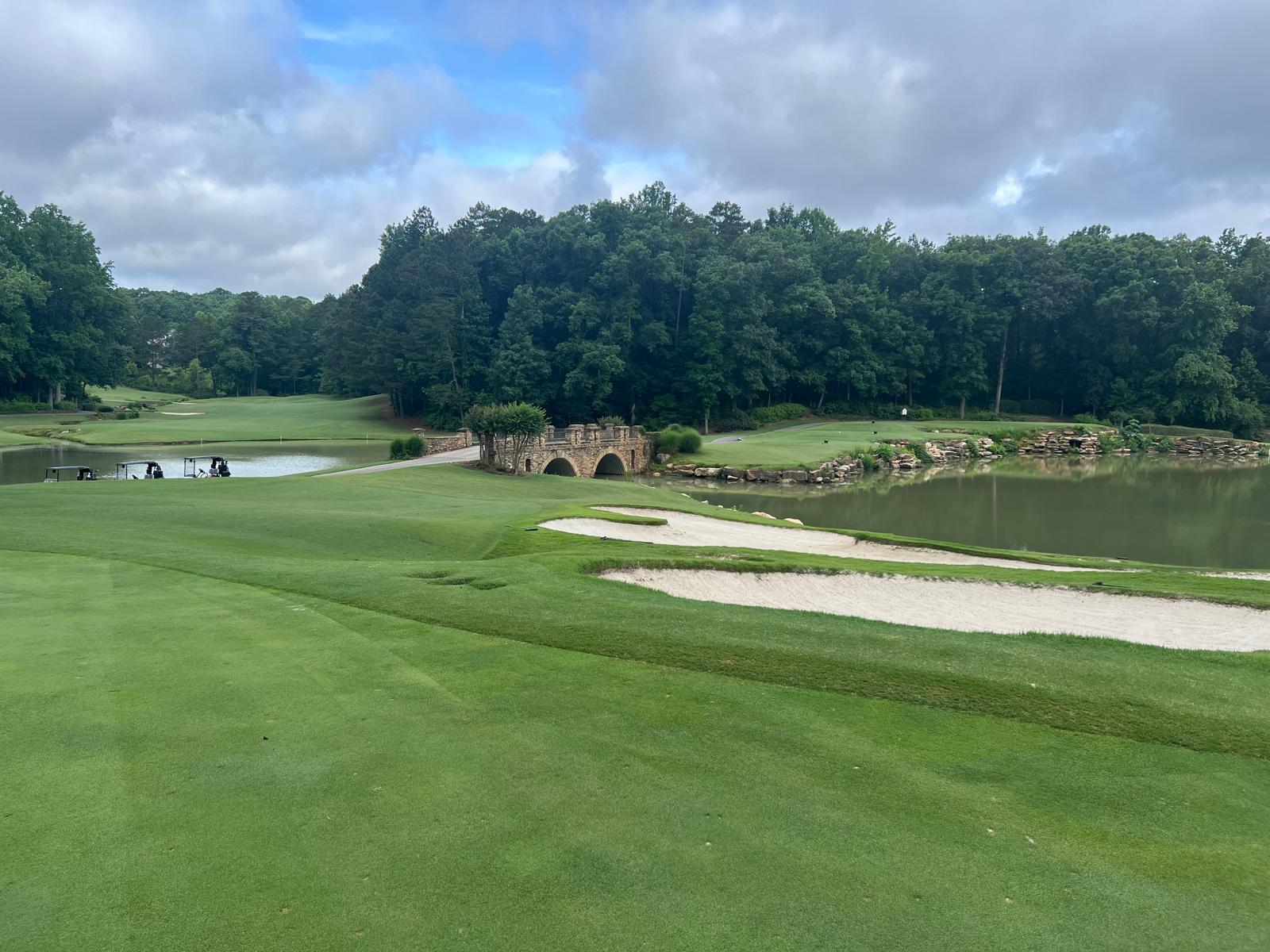 Stone bridge, water and bunkers on the St. Marlo golf course