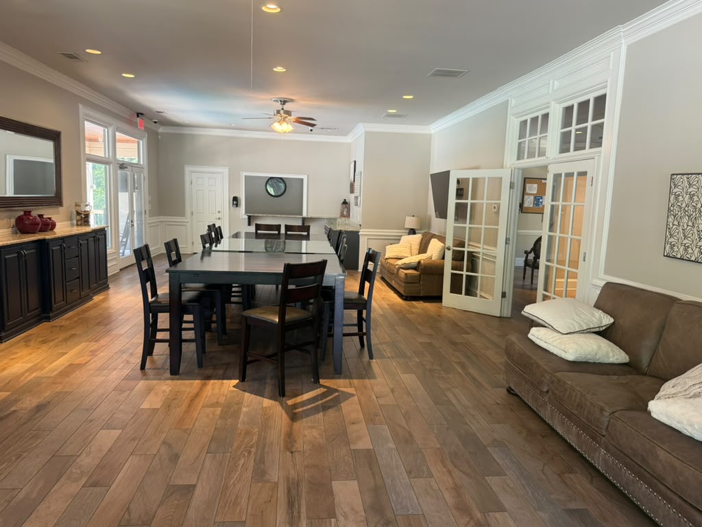 Dining and lounge room inside the St. Marlo Cabana and community office area