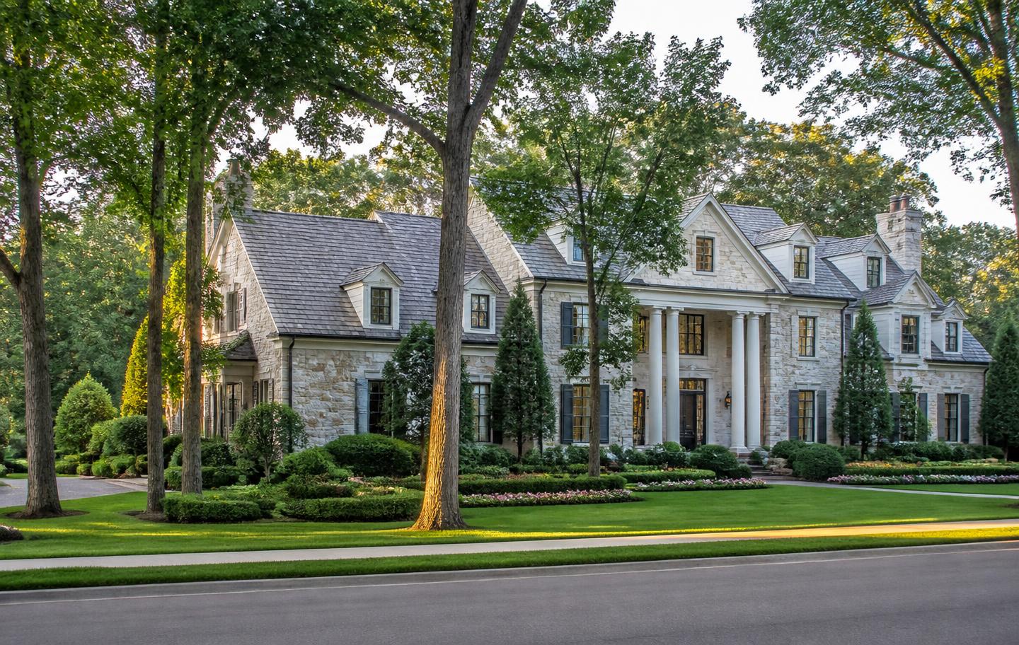 Stone country-club estate on a tree-lined street in Sugarloaf