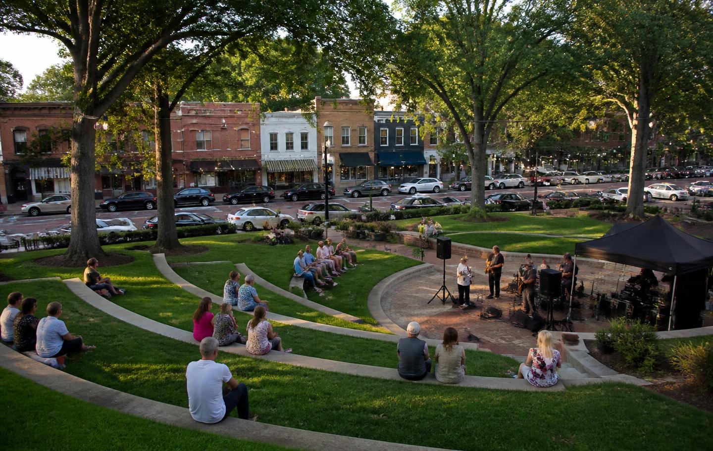 Town green amphitheater and historic storefronts in downtown Suwanee